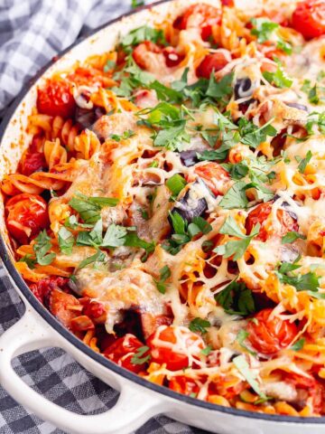 Close up of baked pasta in a white baking dish