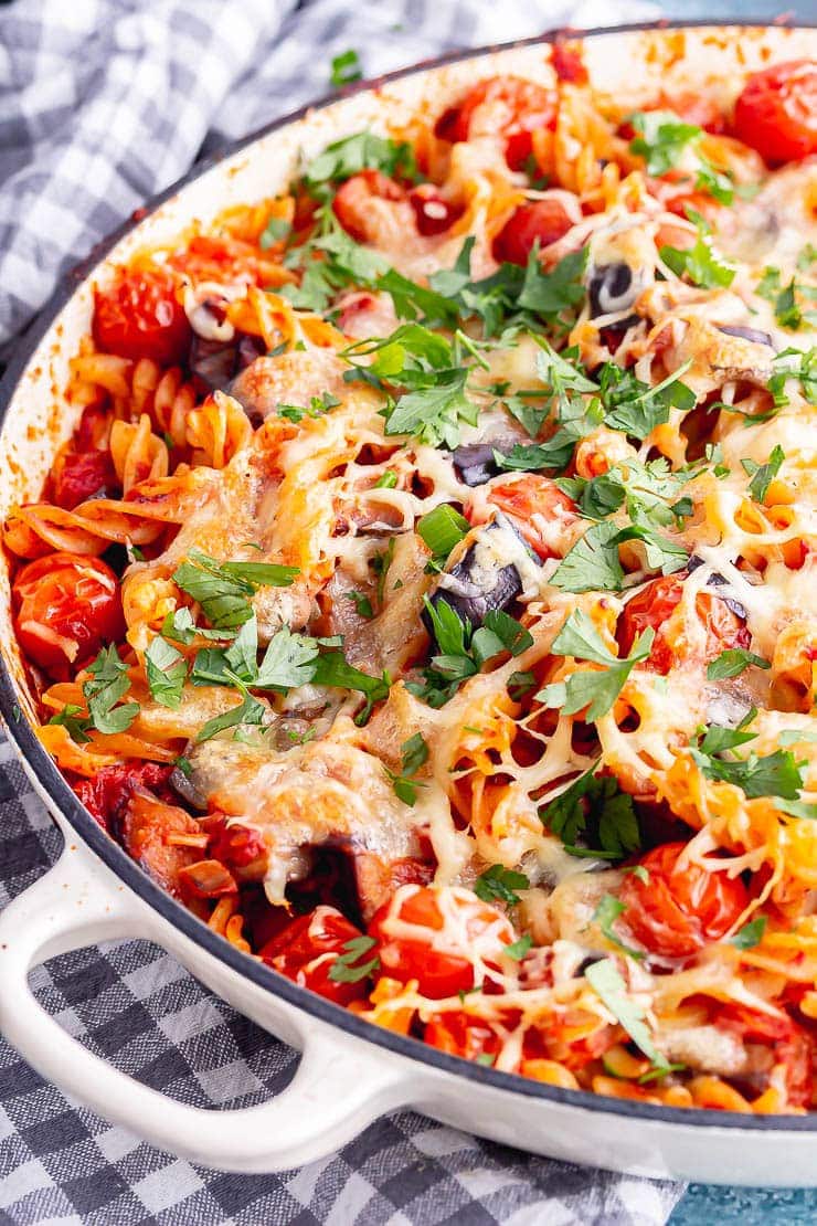 Close up of baked pasta in a white baking dish