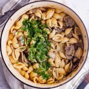 Overhead shot of vegetarian stroganoff with pasta in a white pot