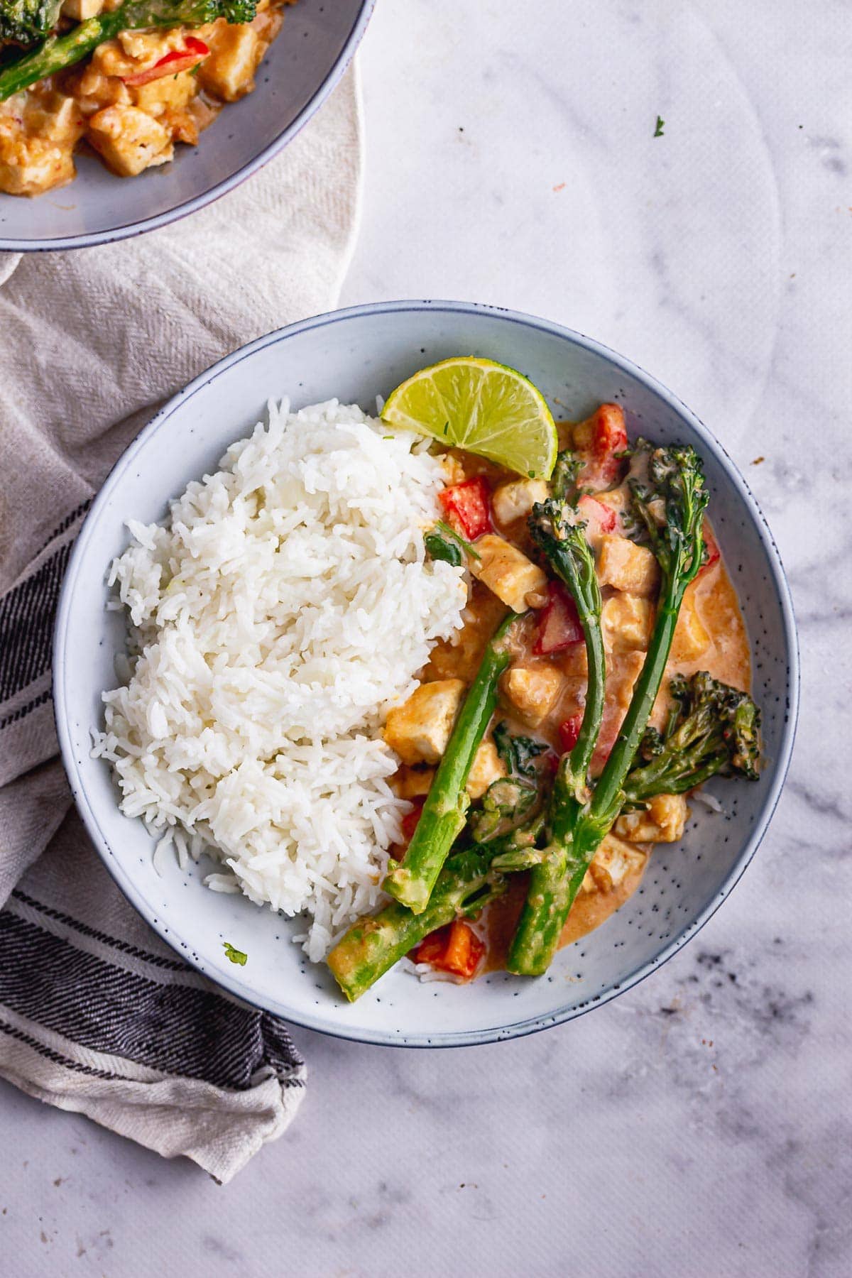 Overhead shot of peanut butter curry with broccoli and rice