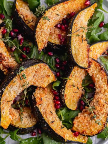 Close up of panko crumbed squash with pomegranate