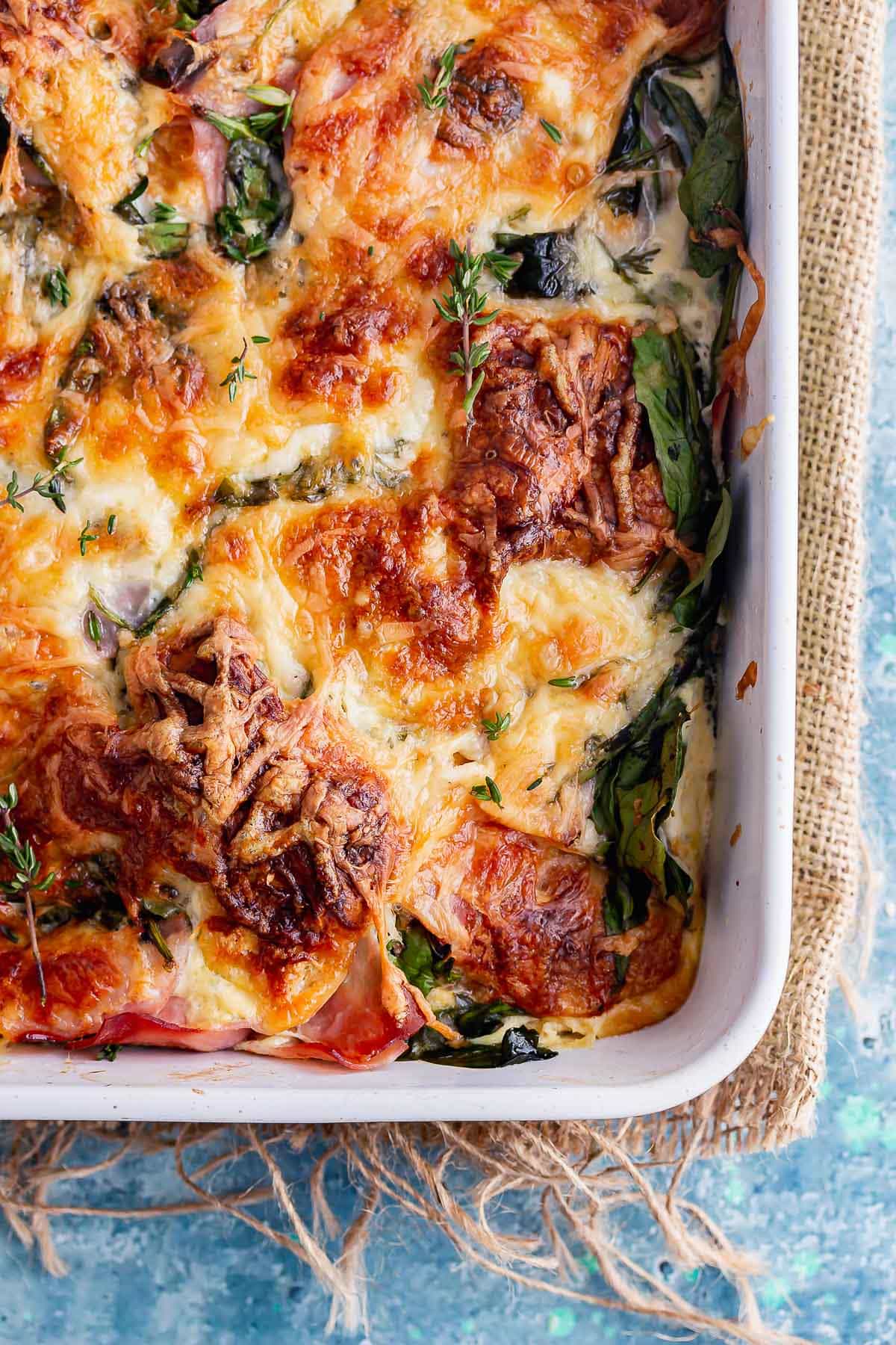 Breakfast bake with ham and cheese on a blue background