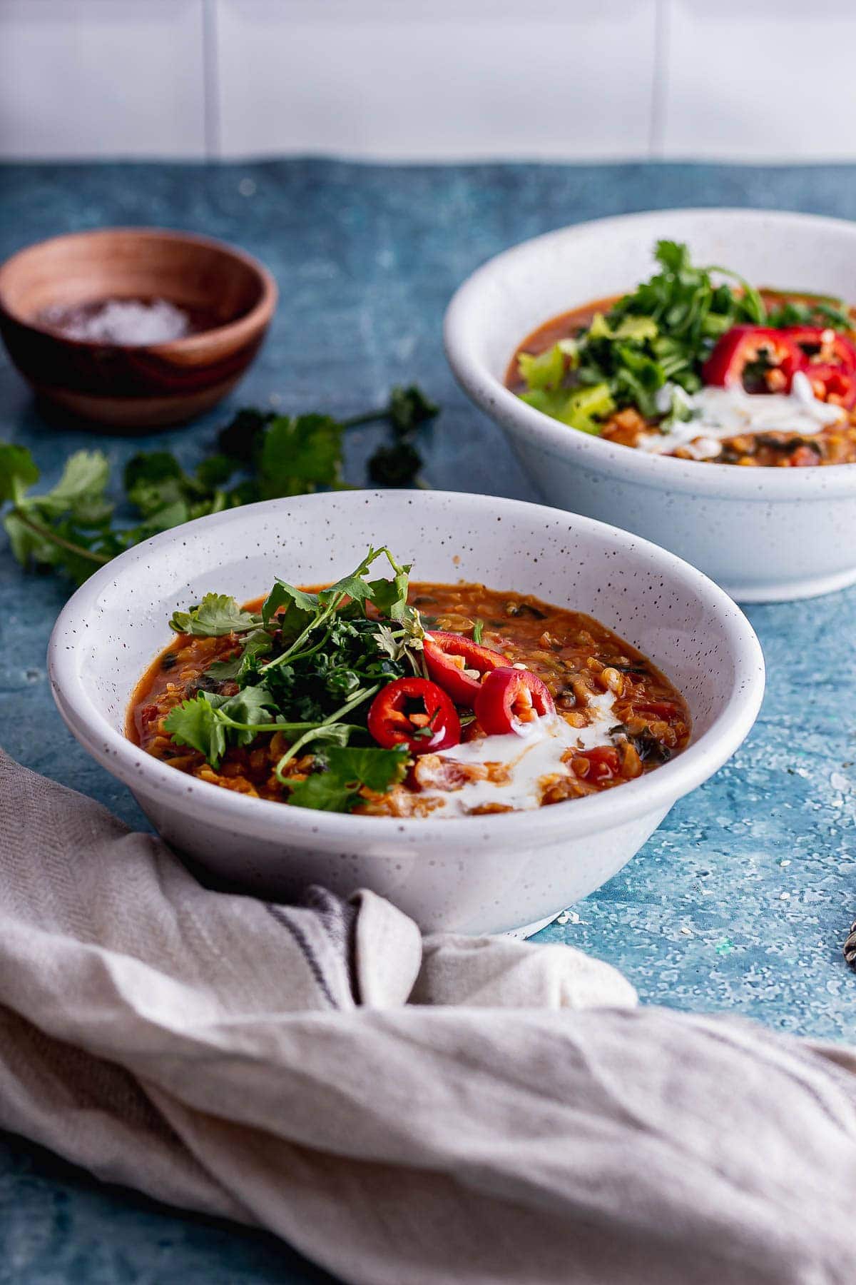 White bowl of spicy soup with lentils 