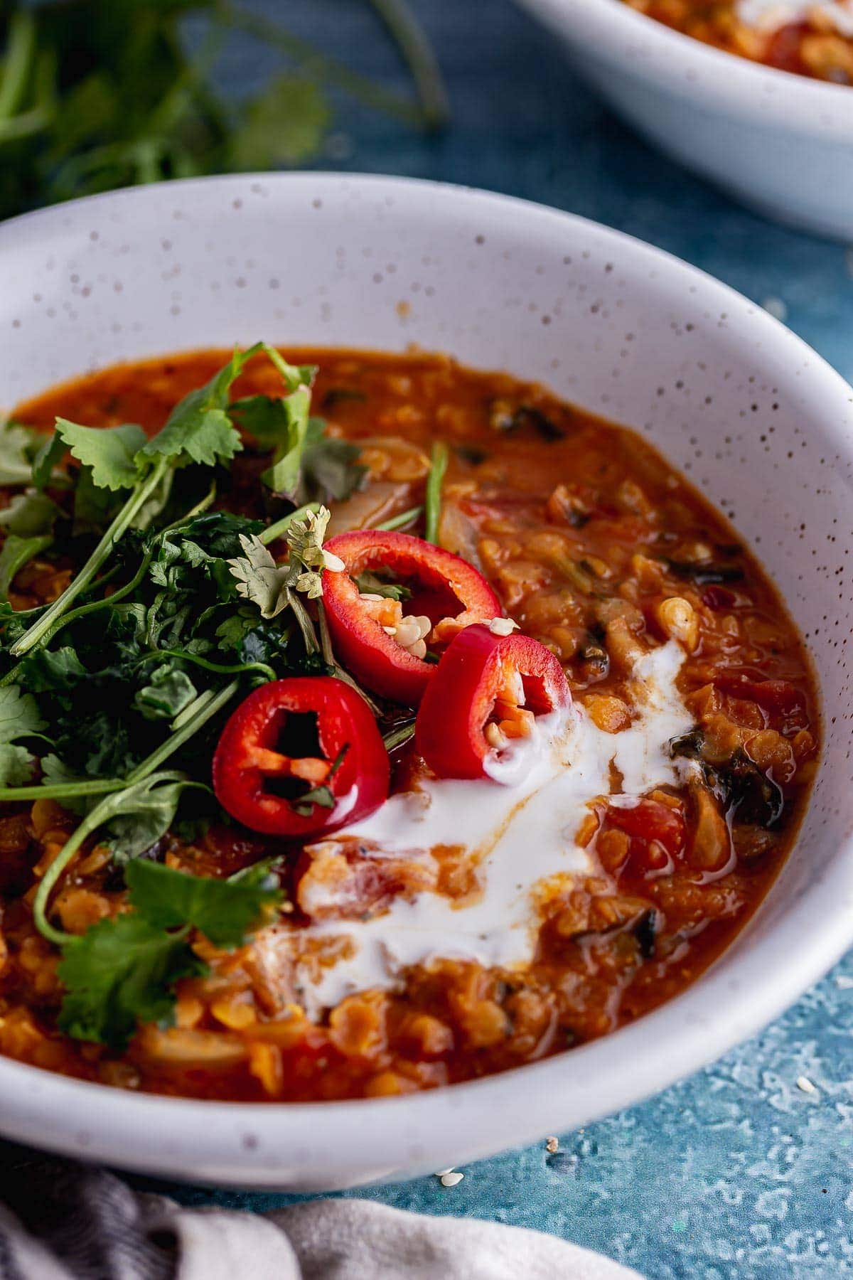 Close up of lentil soup with chilli and coriander