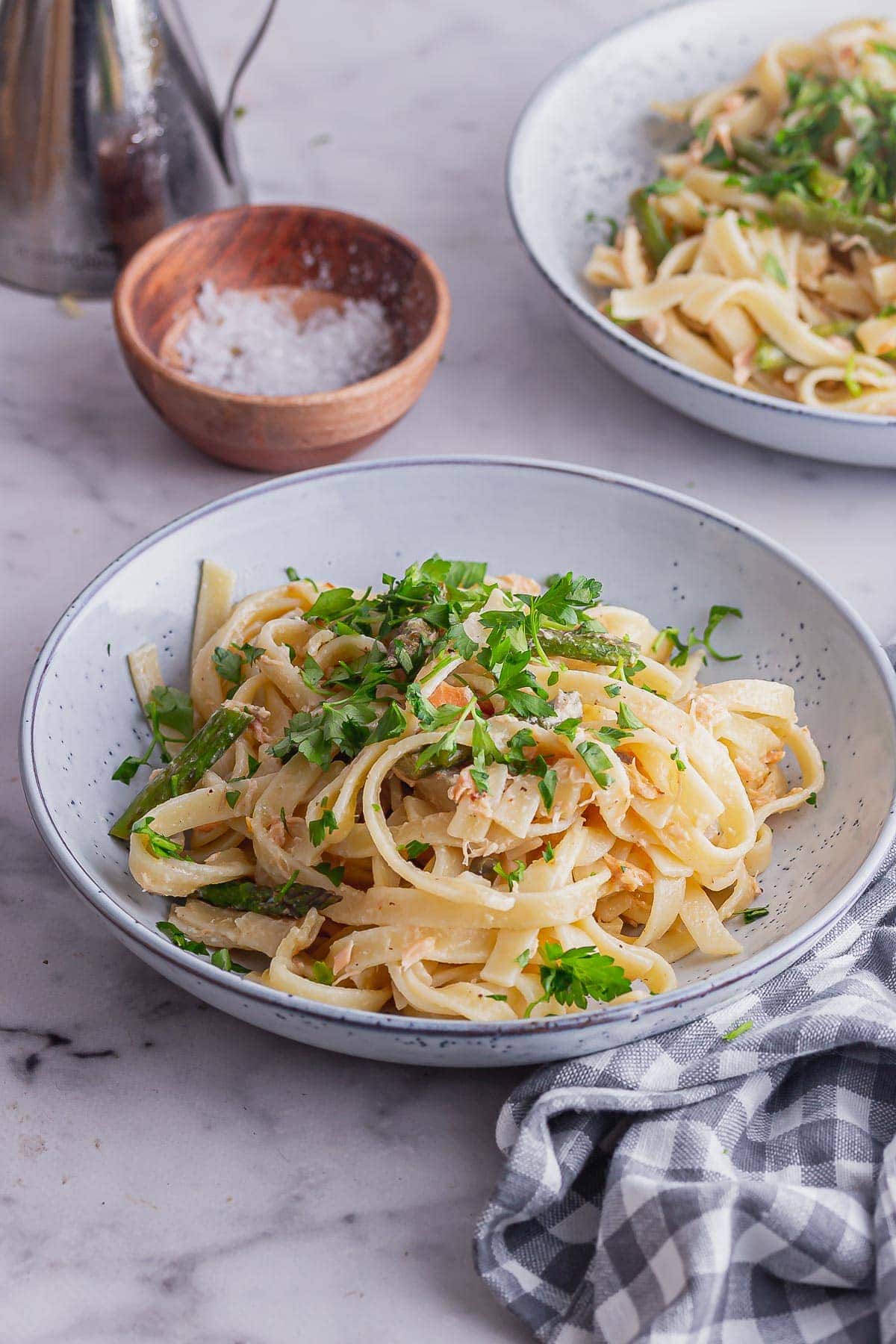 Bowl of pasta with smoked salmon with a checked cloth