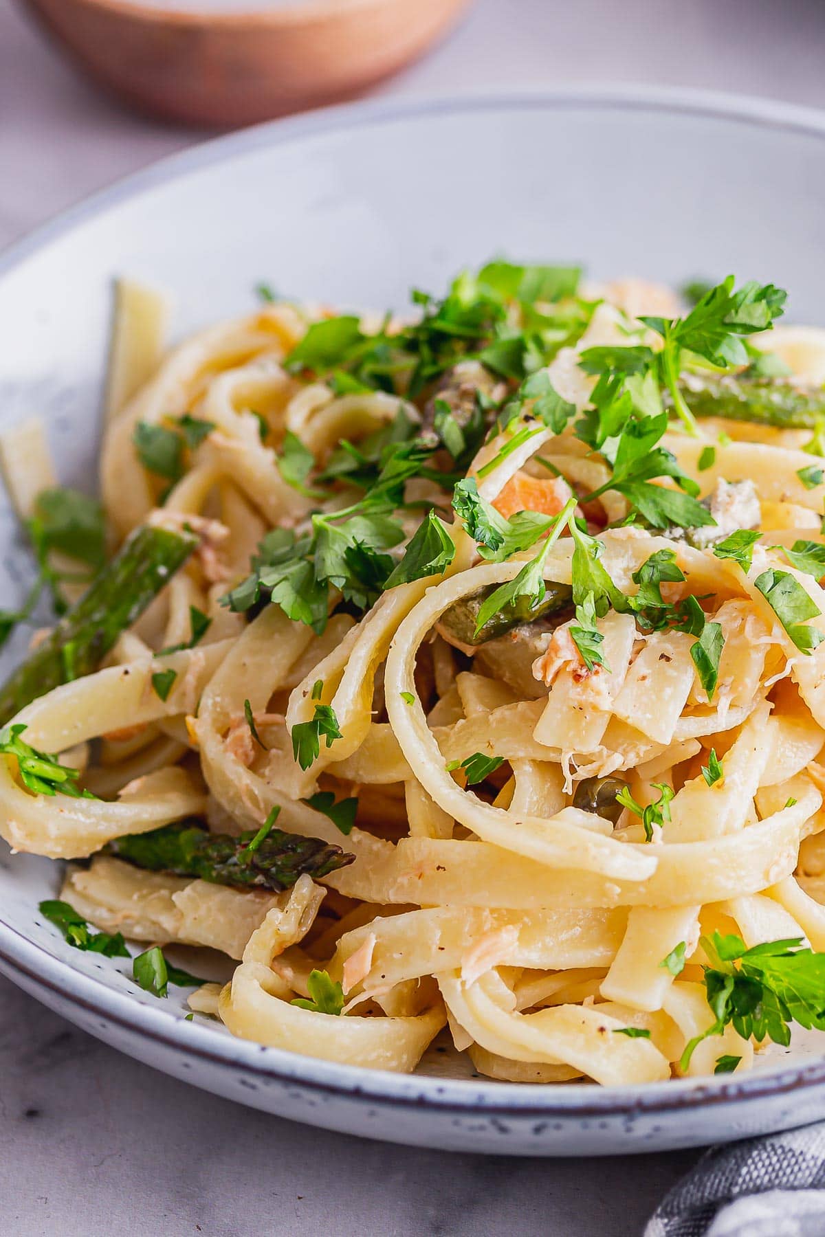 Close up of smoked salmon pasta with parsley