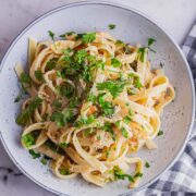 Overhead shot of smoked salmon pasta on a marble surface