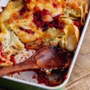 Close up of stuffed pasta shells in a baking dish