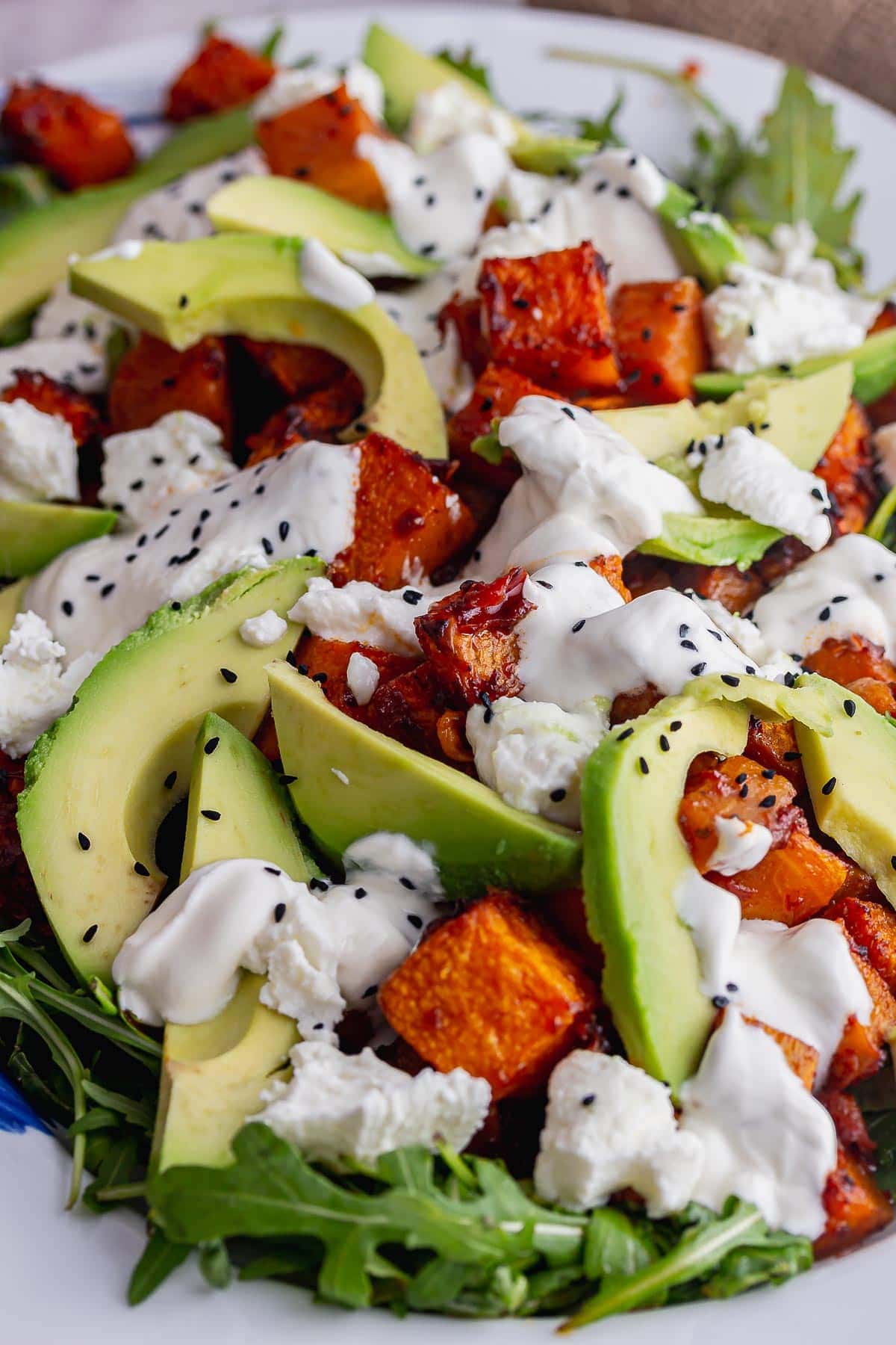 Close up of avocado salad with butternut squash