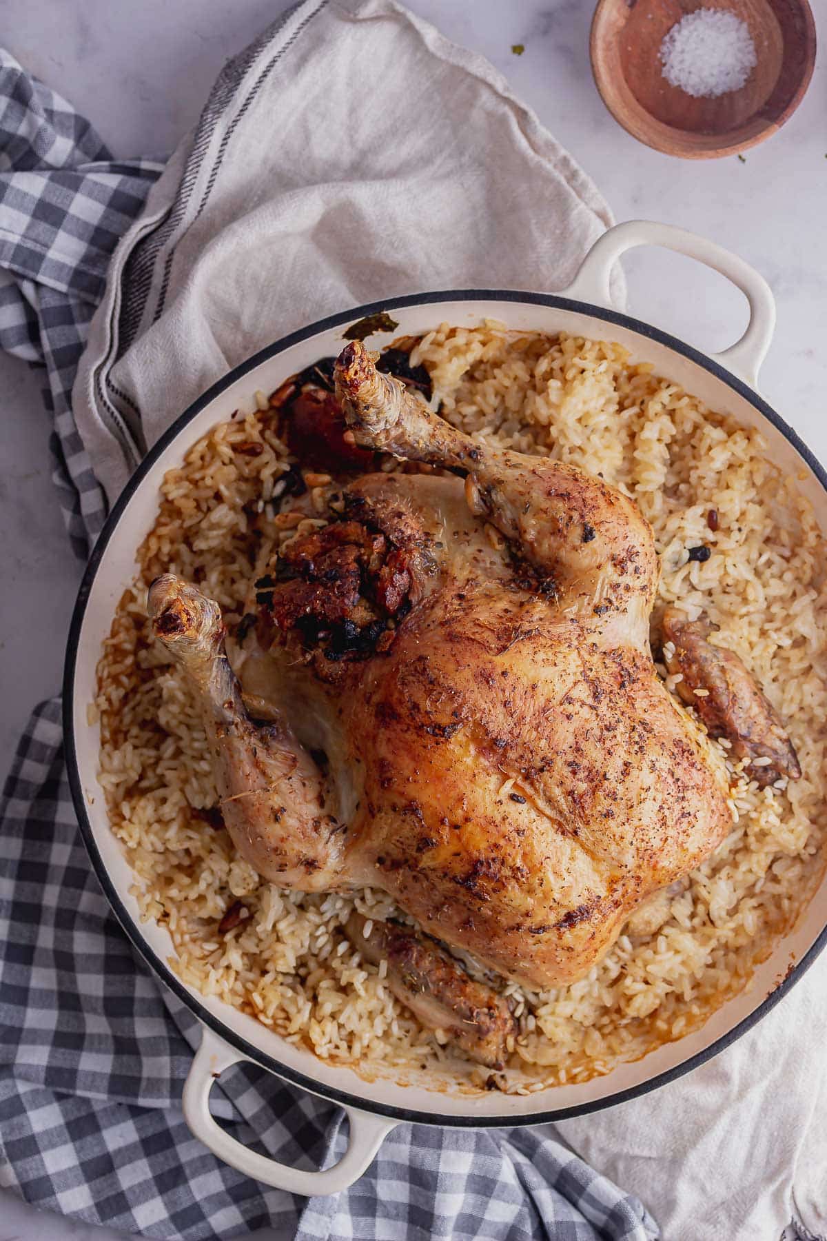 Overhead shot of stuffed chicken risotto bake on a checked cloth