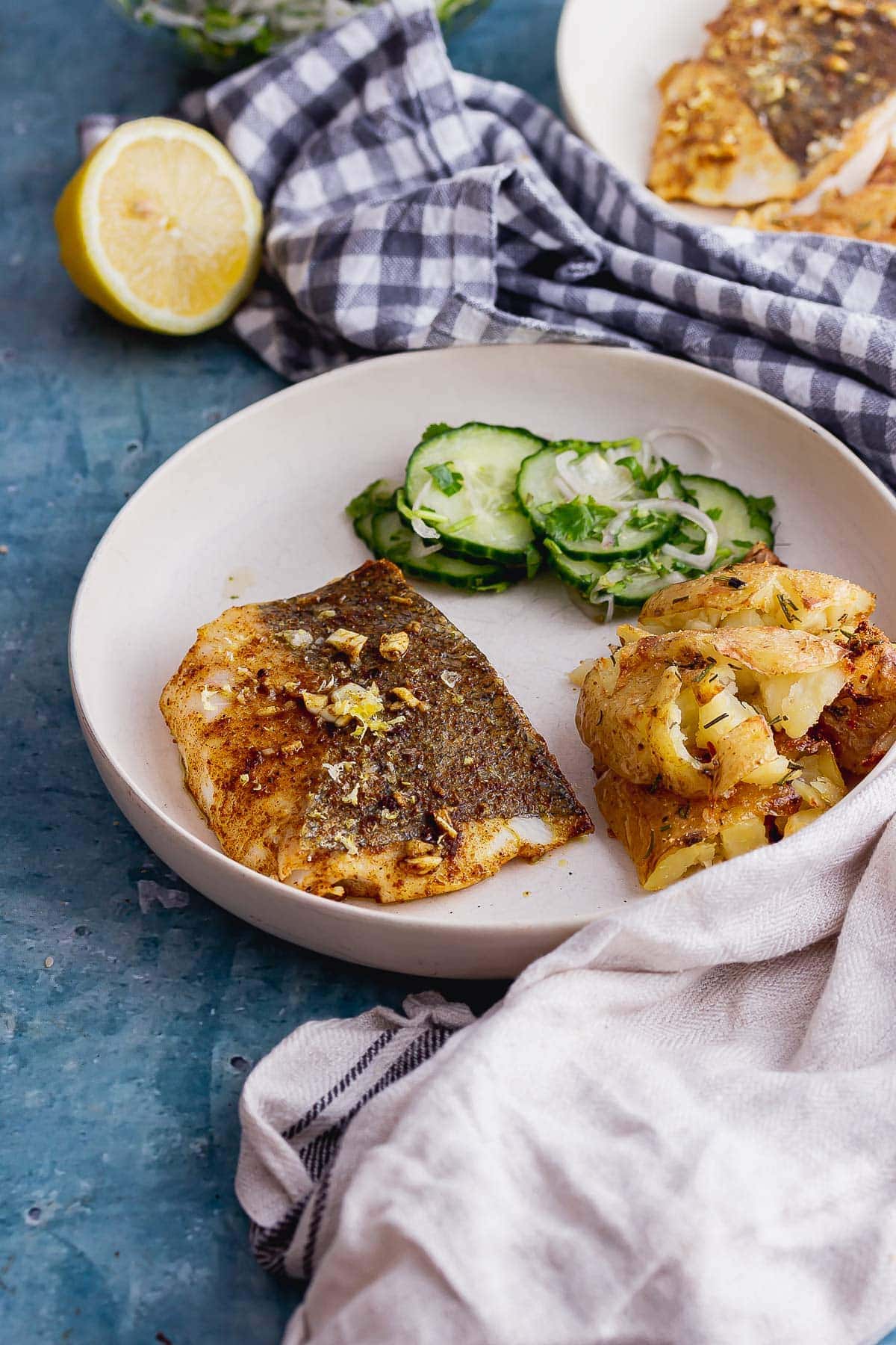 Spiced baked fish on a blue background