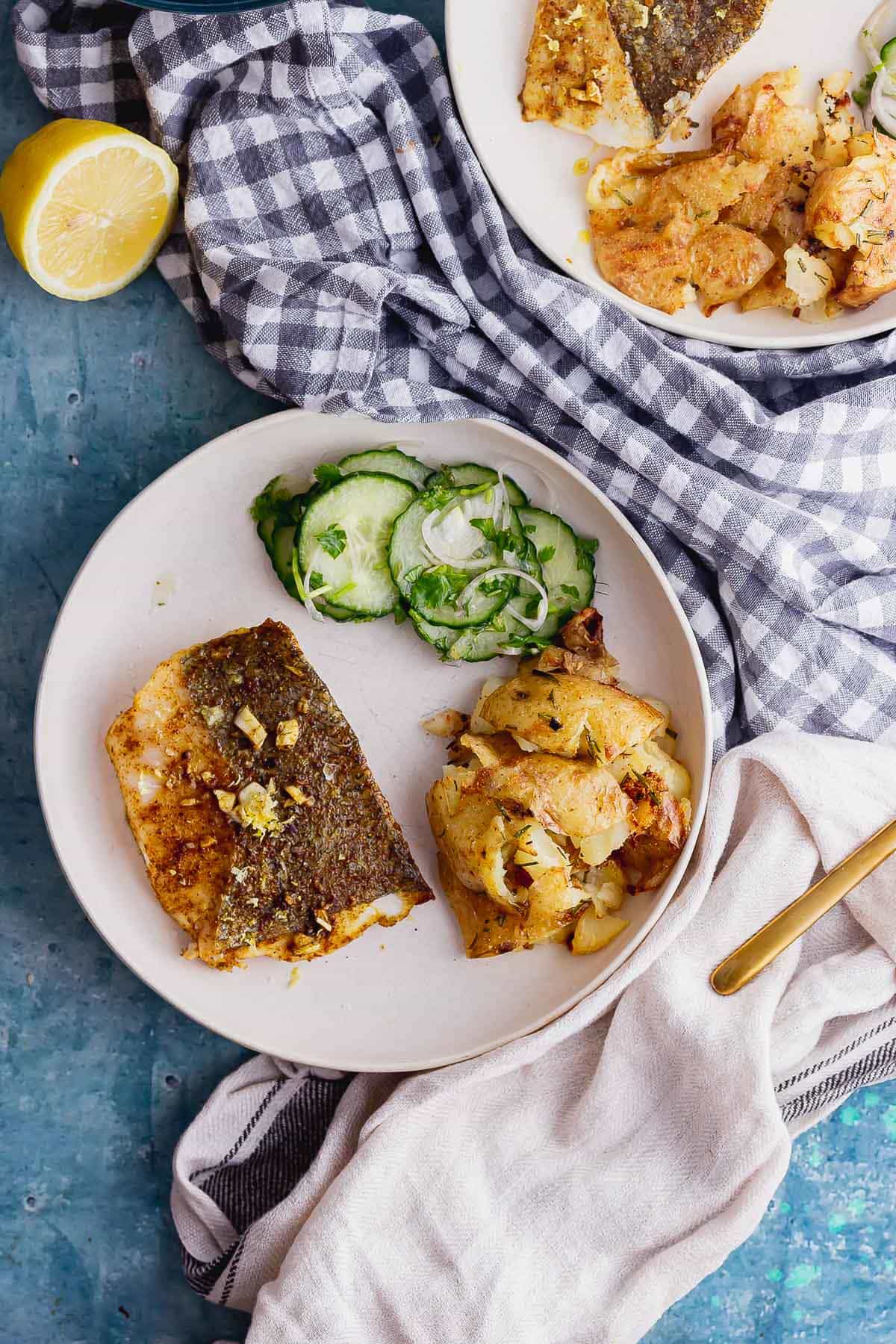 Overhead shot of spiced roasted fish on a blue background