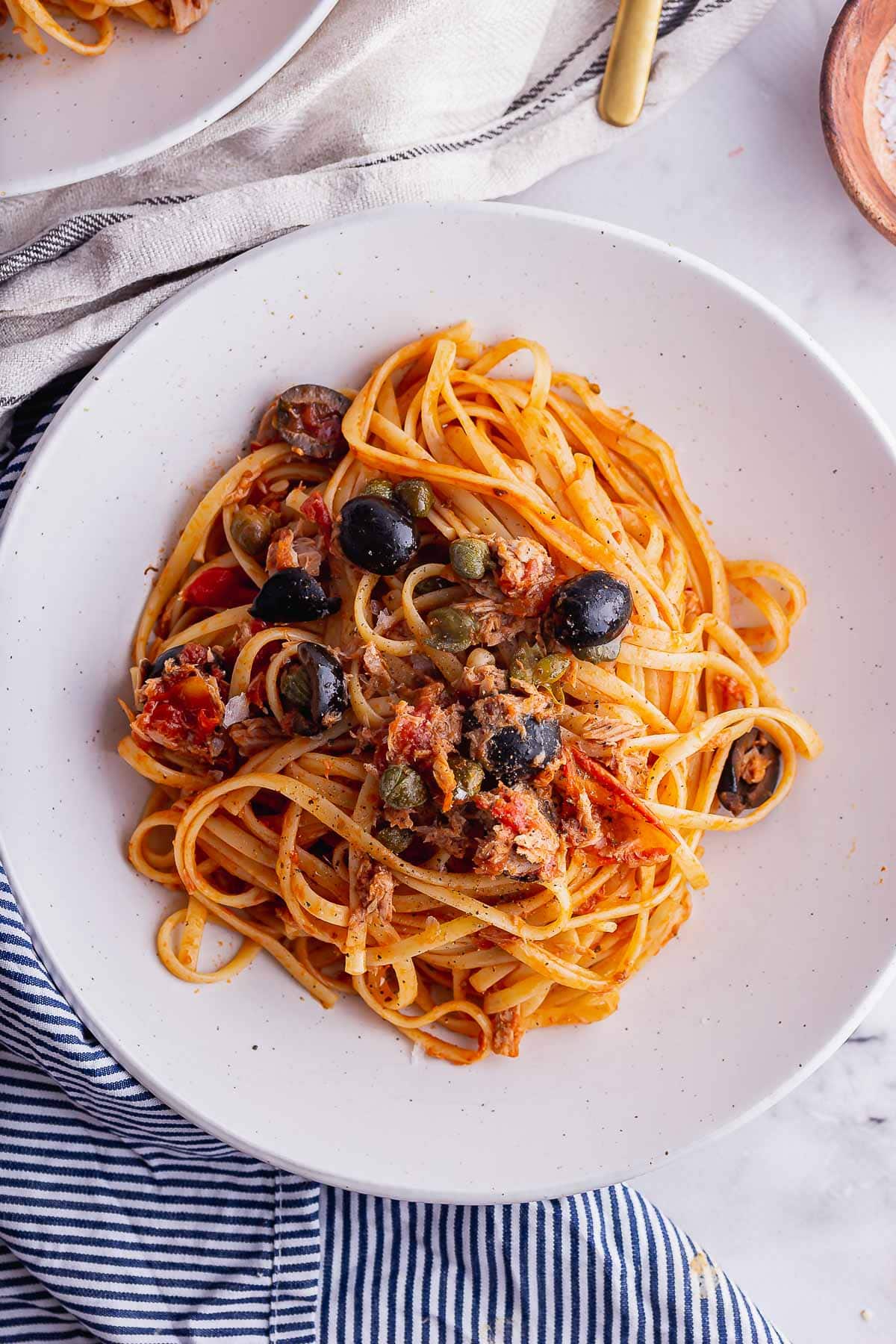 Flat lay shot of tuna tomato pasta with olive 