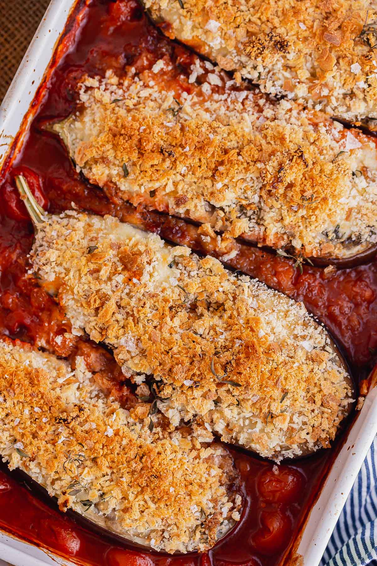 Overhead shot of cheesy aubergine in a tomato sauce