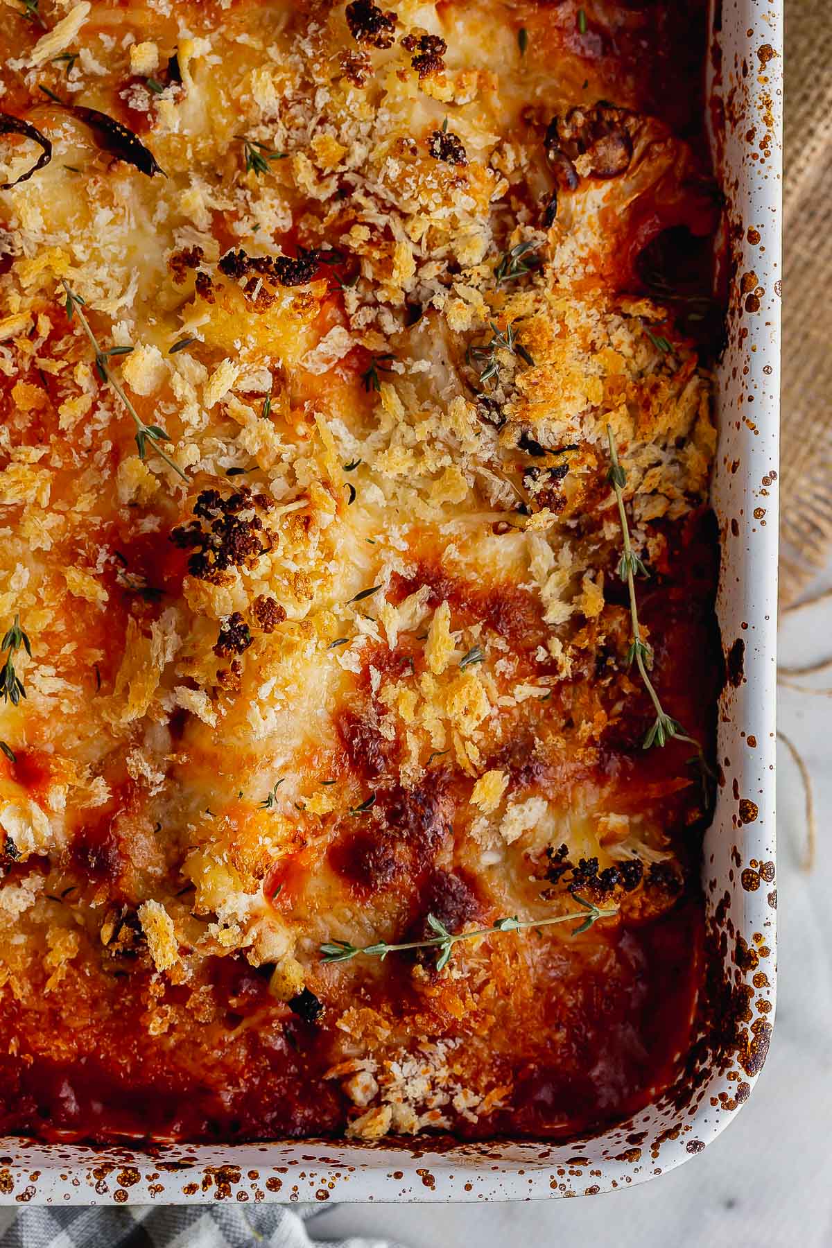 Overhead shot of cheesy cauliflower with tomato