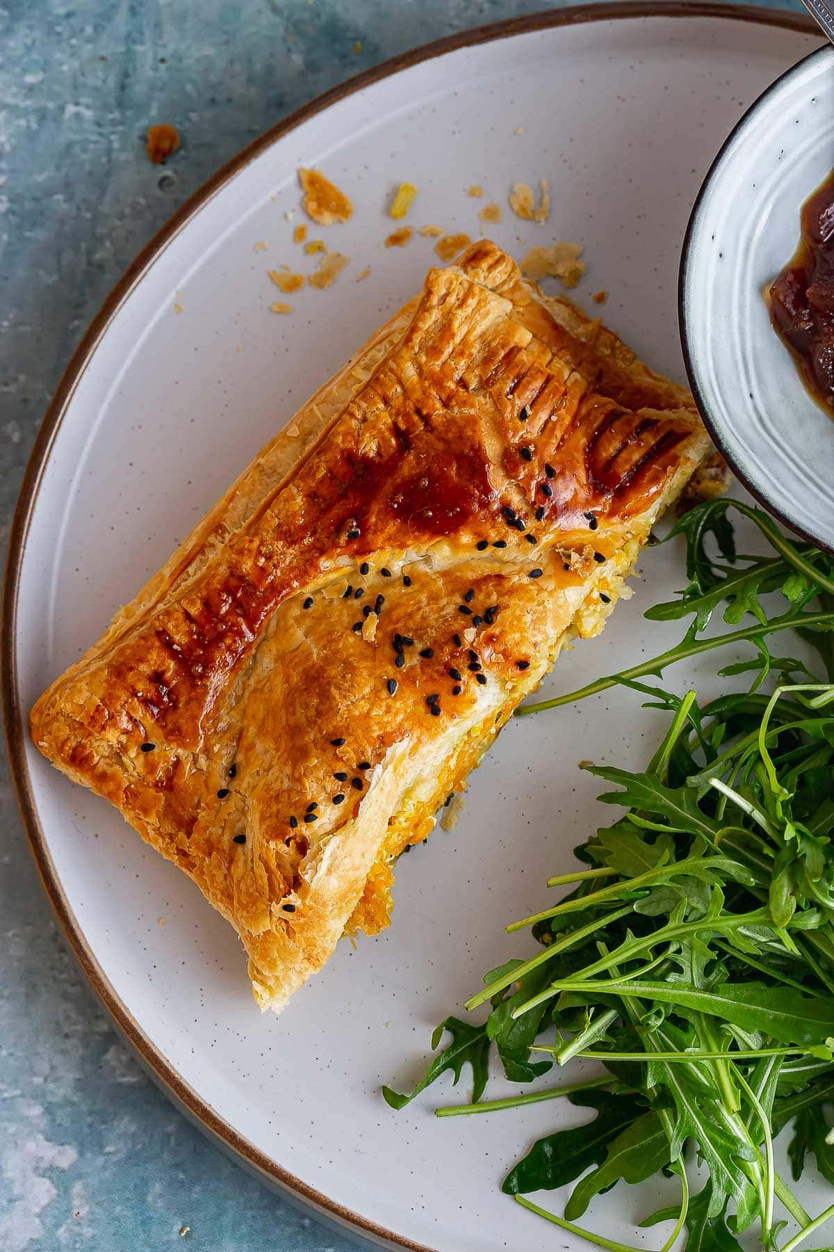 Overhead shot of a piece of squash wellington on a grey plate