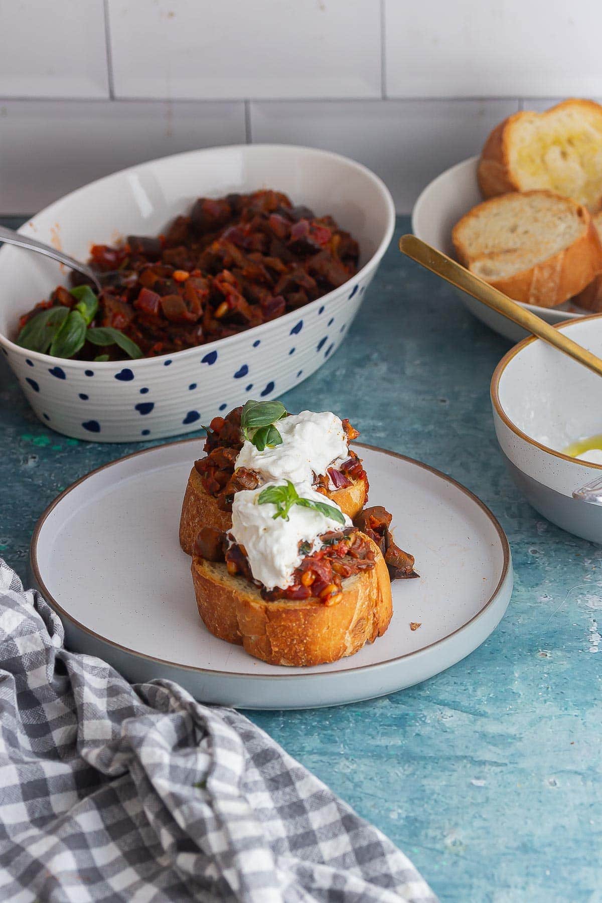 Eggplant toasts on a blue background