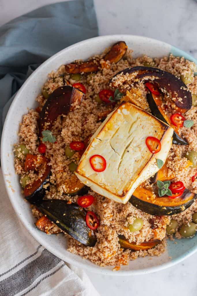 Overhead shot of salad with feta and couscous