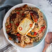 Overhead shot of a serving platter of couscous on a marble surface