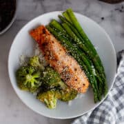 White bowl of salmon and vegetables