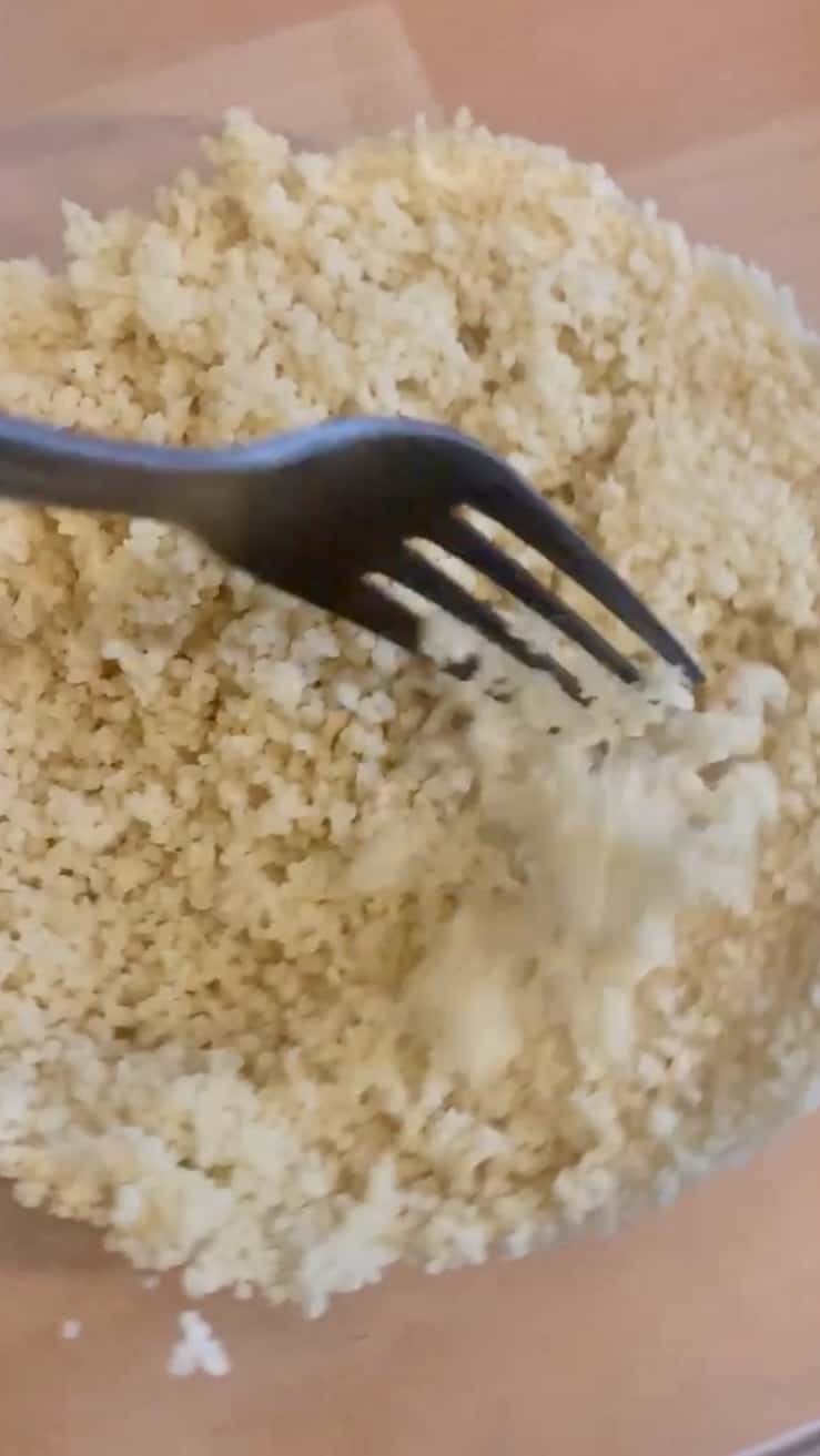 Close up of a fork and couscous