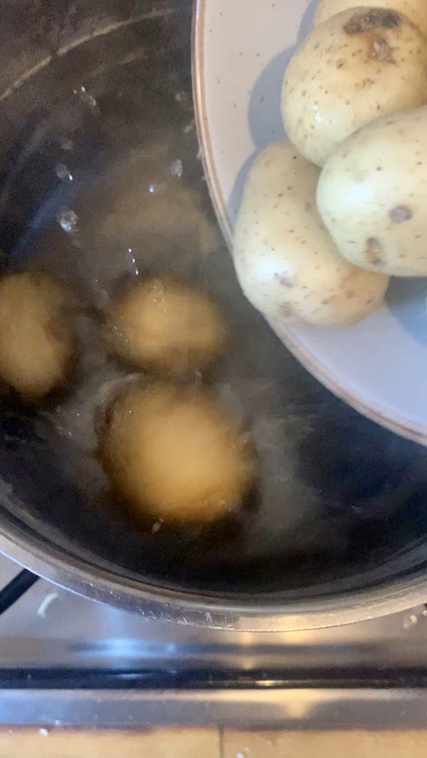 Saucepan of water with potatoes