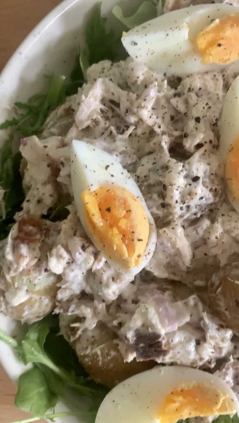 Close up of boiled eggs on a mackerel salad