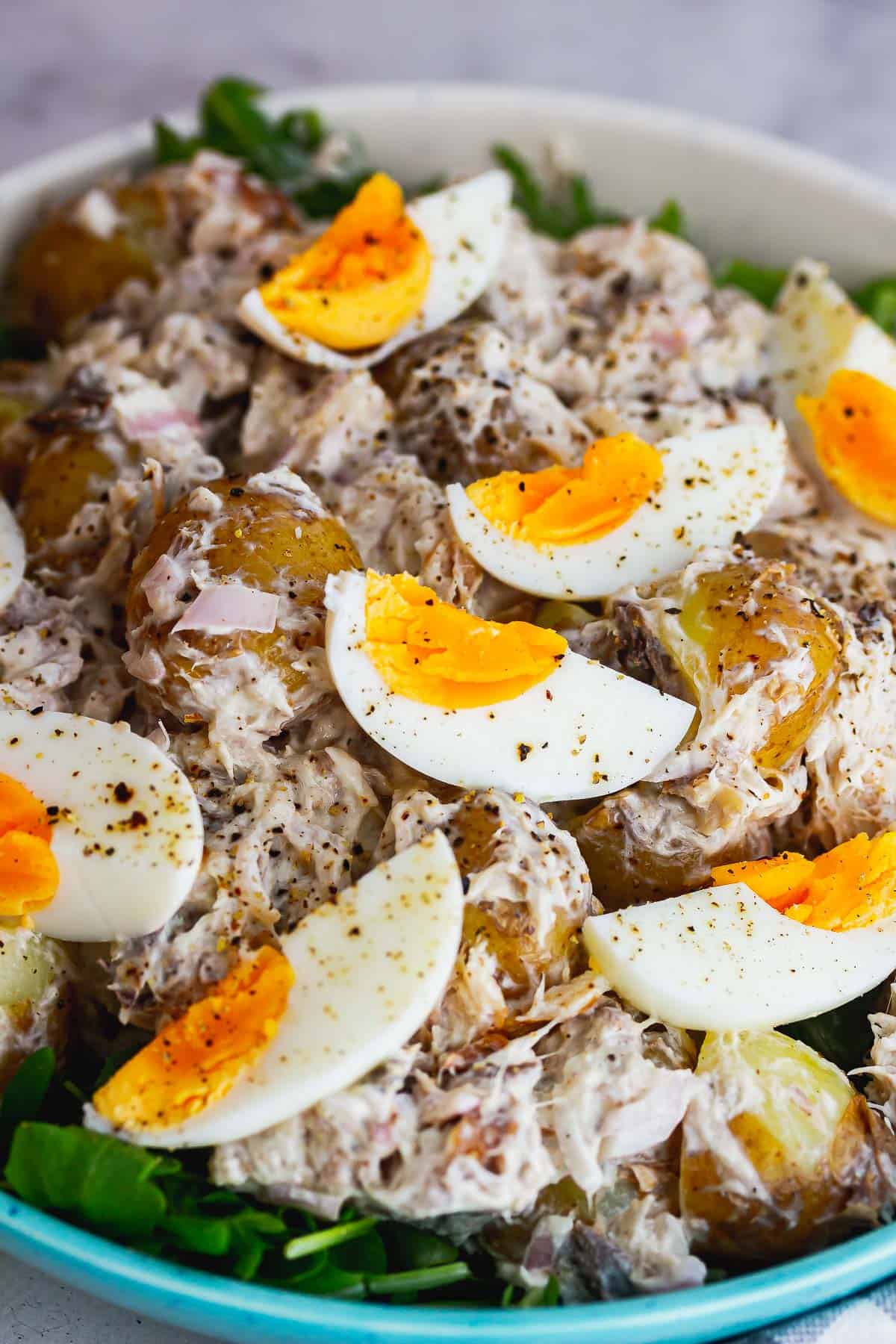 Close up of salad topped with boiled eggs
