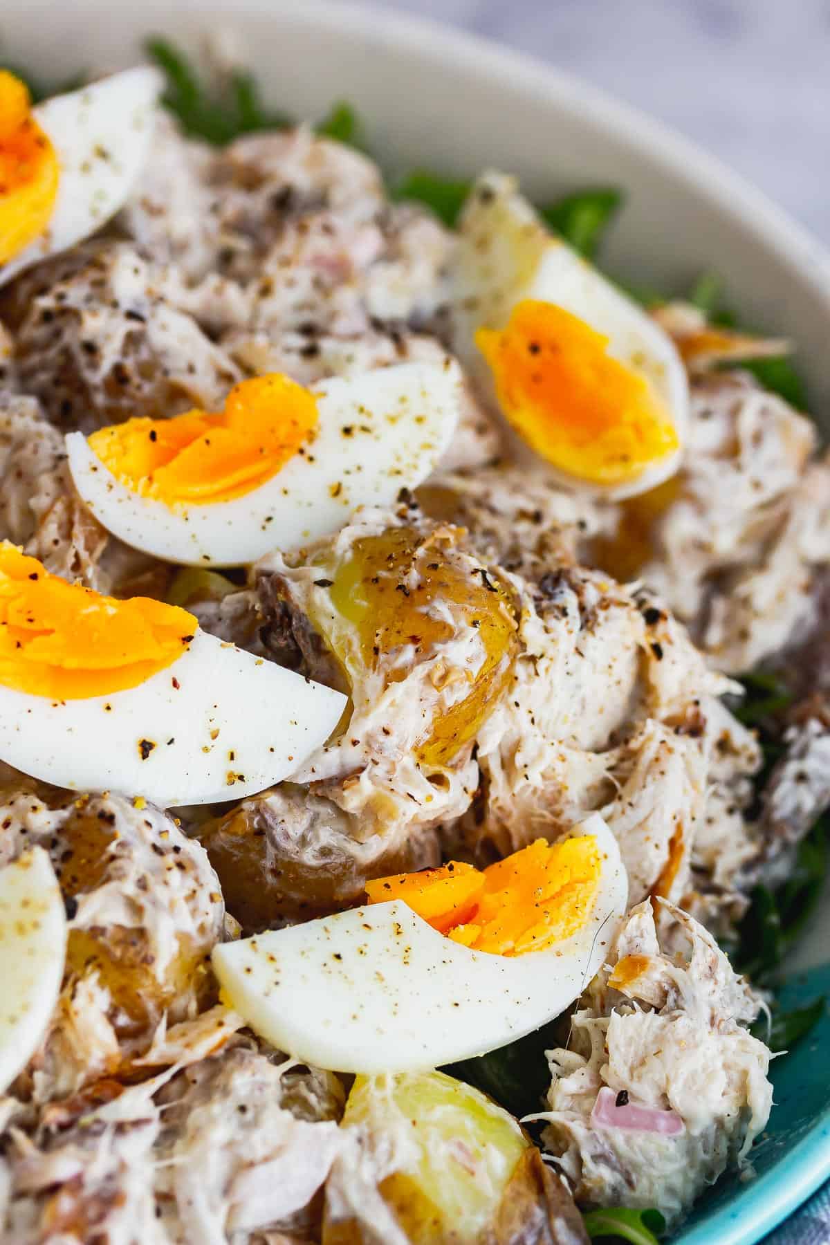 Close up of salad topped with eggs