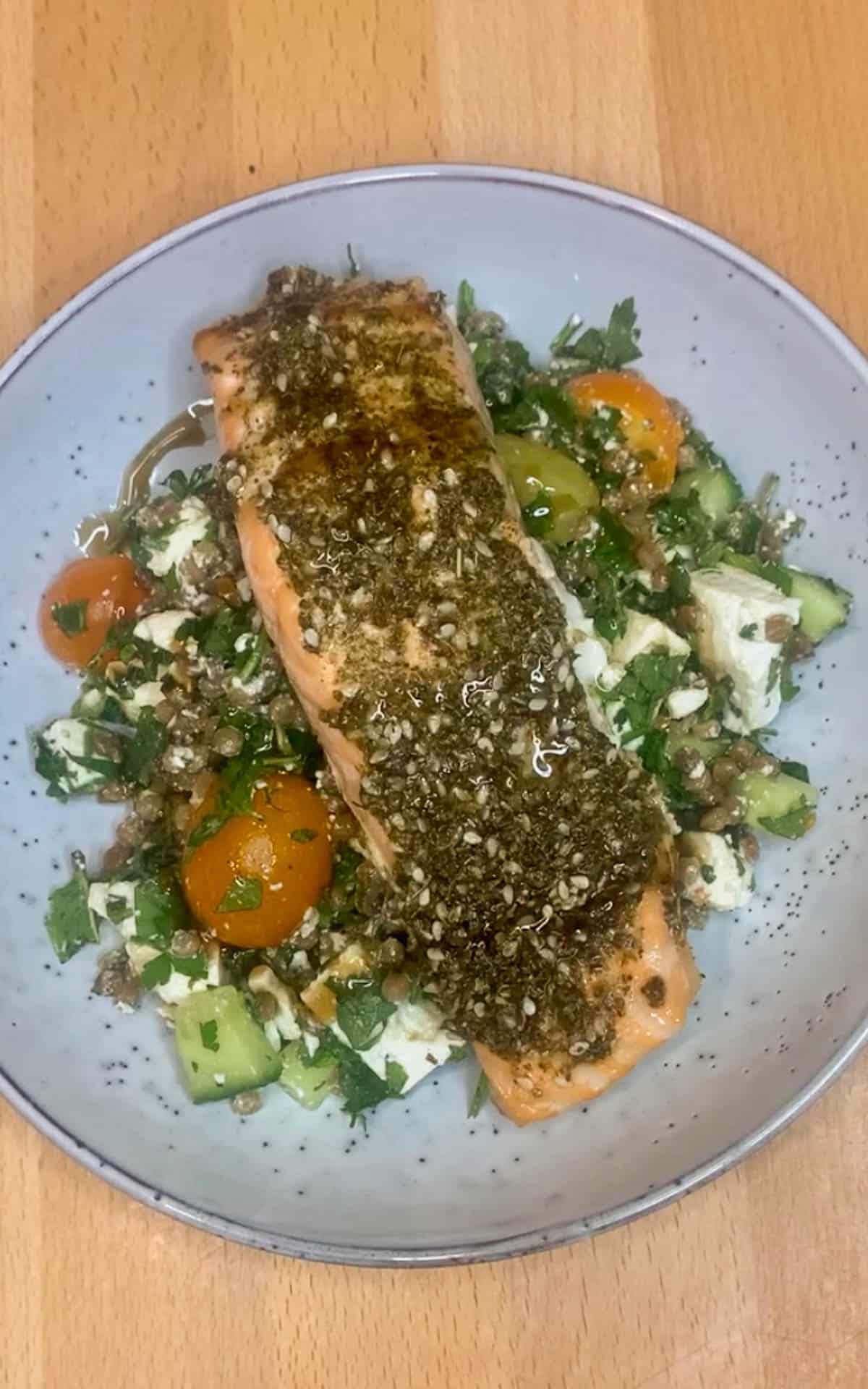 Blue bowl of salmon and salad