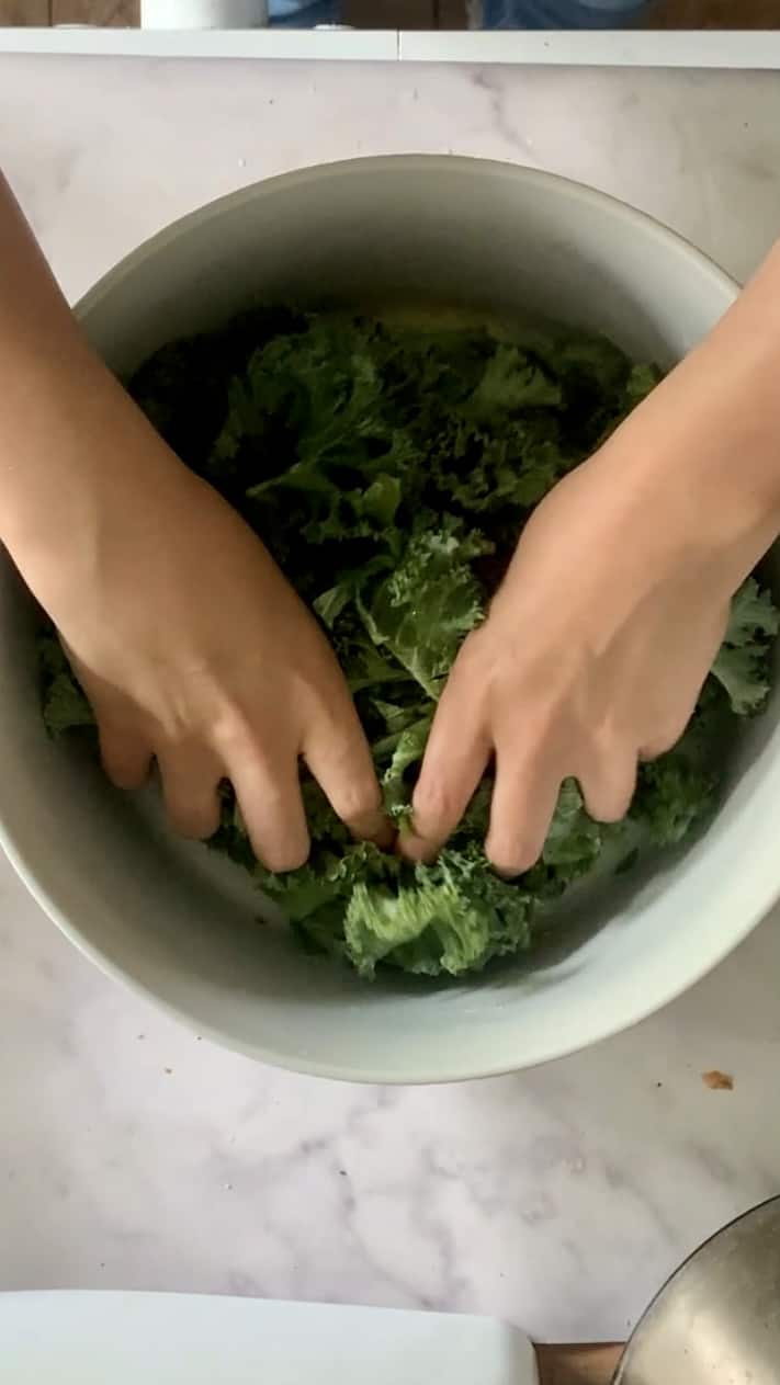 Overhead shot of hands massaging kale