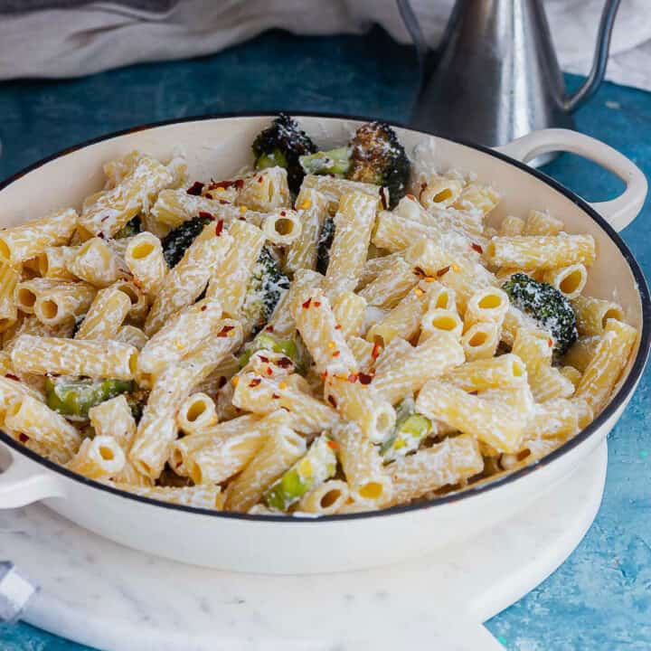 White dish of pasta with broccoli