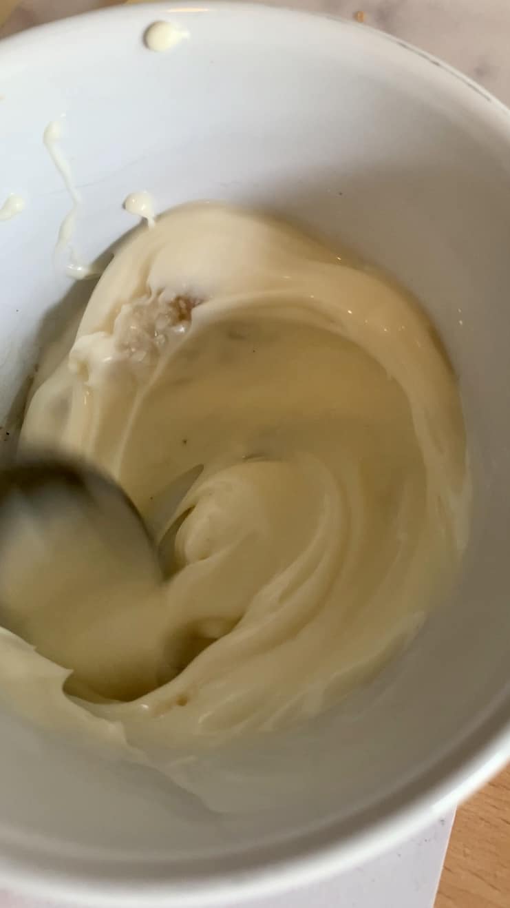 Mayonnaise in a bowl with a spoon