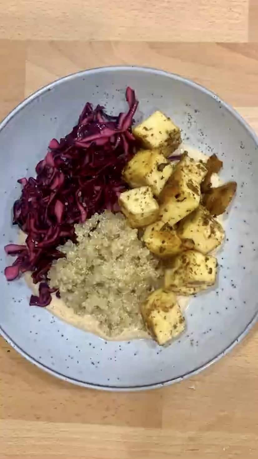 Paneer, quinoa and slaw in a blue bowl