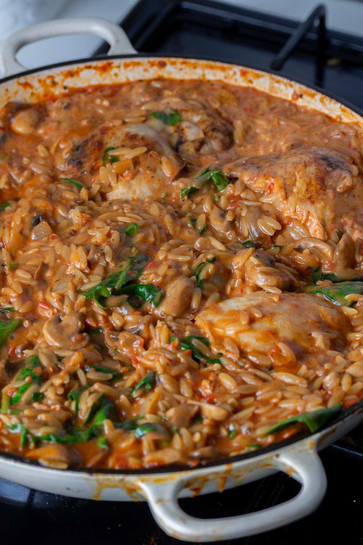 Chicken orzo one pot in a white pan