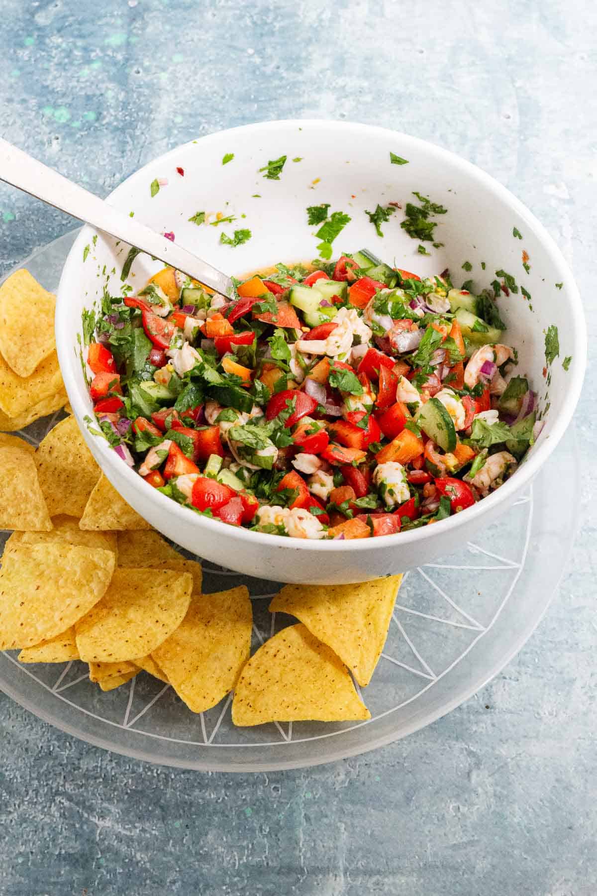 White bowl of food on a blue surface