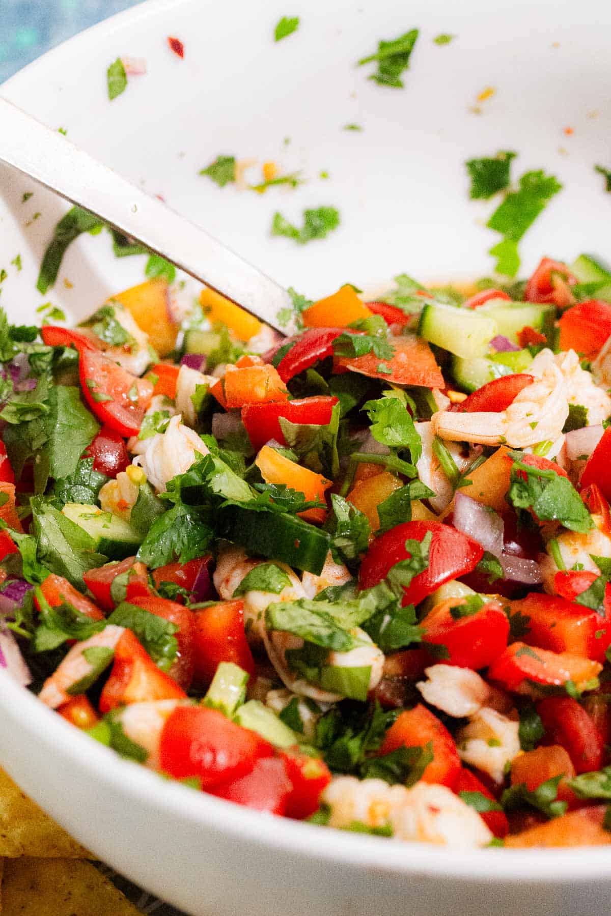 Food in a white bowl with a spoon